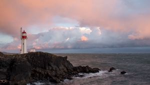 Preview wallpaper lighthouse, rock, cliff, sea