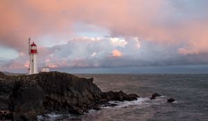 Preview wallpaper lighthouse, rock, cliff, sea