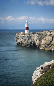 Preview wallpaper lighthouse, rock, cliff, sea, landscape