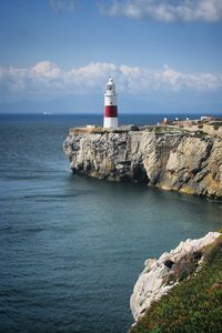 Preview wallpaper lighthouse, rock, cliff, sea, landscape
