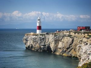 Preview wallpaper lighthouse, rock, cliff, sea, landscape