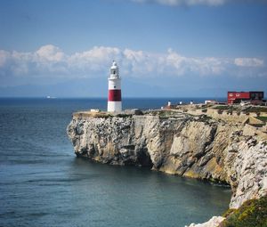 Preview wallpaper lighthouse, rock, cliff, sea, landscape