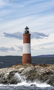 Preview wallpaper lighthouse, rock, sea, spray, mountains