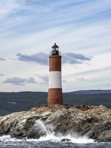 Preview wallpaper lighthouse, rock, sea, spray, mountains