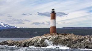 Preview wallpaper lighthouse, rock, sea, spray, mountains