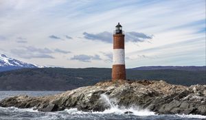 Preview wallpaper lighthouse, rock, sea, spray, mountains