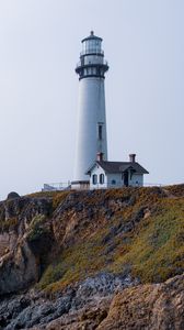 Preview wallpaper lighthouse, rock, slope, relief