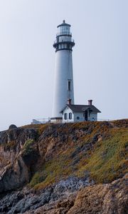 Preview wallpaper lighthouse, rock, slope, relief