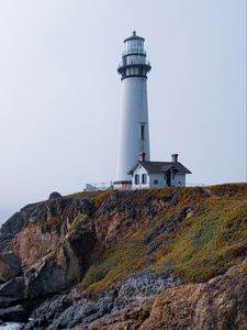 Preview wallpaper lighthouse, rock, slope, relief