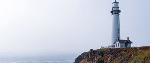 Preview wallpaper lighthouse, rock, slope, relief