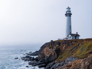 Preview wallpaper lighthouse, rock, slope, relief