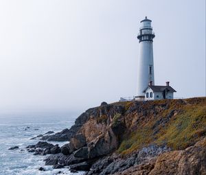 Preview wallpaper lighthouse, rock, slope, relief