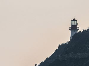 Preview wallpaper lighthouse, rock, waves, sea, shore