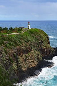 Preview wallpaper lighthouse, rocks, cliff, sea, surf