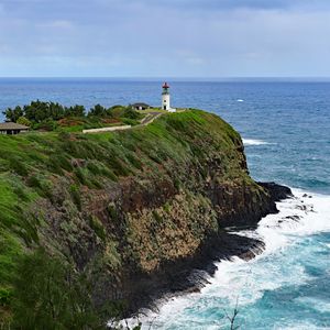 Preview wallpaper lighthouse, rocks, cliff, sea, surf