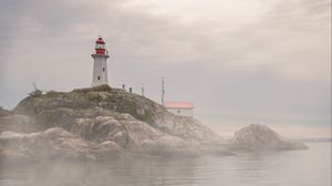 Preview wallpaper lighthouse, rocks, fog, coast, water
