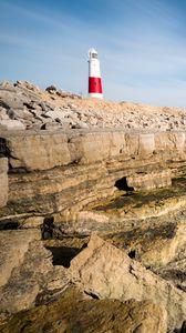 Preview wallpaper lighthouse, rocks, relief, stones, nature