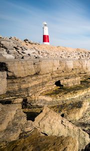 Preview wallpaper lighthouse, rocks, relief, stones, nature