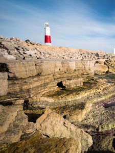 Preview wallpaper lighthouse, rocks, relief, stones, nature