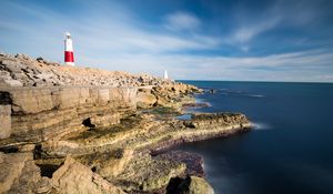 Preview wallpaper lighthouse, rocks, relief, stones, nature