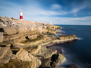 Preview wallpaper lighthouse, rocks, relief, stones, nature