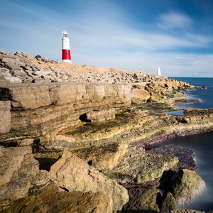 Preview wallpaper lighthouse, rocks, relief, stones, nature