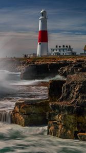 Preview wallpaper lighthouse, rocks, sea, spray, water