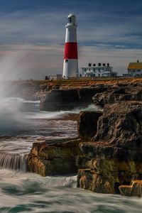 Preview wallpaper lighthouse, rocks, sea, spray, water