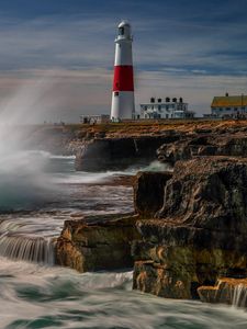 Preview wallpaper lighthouse, rocks, sea, spray, water