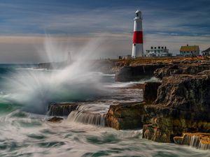 Preview wallpaper lighthouse, rocks, sea, spray, water