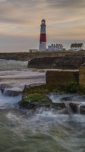 Preview wallpaper lighthouse, rocks, sea, waves, landscape