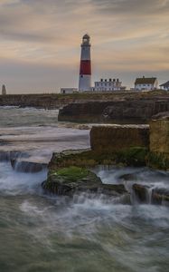 Preview wallpaper lighthouse, rocks, sea, waves, landscape