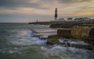 Preview wallpaper lighthouse, rocks, sea, waves, landscape