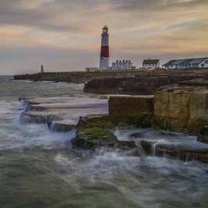 Preview wallpaper lighthouse, rocks, sea, waves, landscape