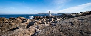 Preview wallpaper lighthouse, rocks, stones, sea, clouds, nature