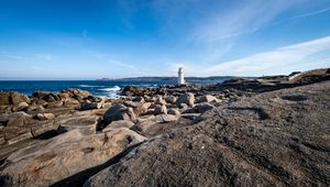 Preview wallpaper lighthouse, rocks, stones, sea, clouds, nature