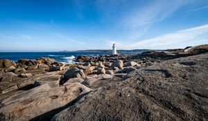 Preview wallpaper lighthouse, rocks, stones, sea, clouds, nature