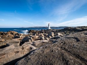 Preview wallpaper lighthouse, rocks, stones, sea, clouds, nature
