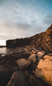 Preview wallpaper lighthouse, rocks, stones, cliff
