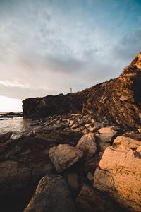 Preview wallpaper lighthouse, rocks, stones, cliff
