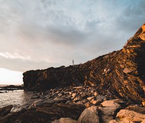 Preview wallpaper lighthouse, rocks, stones, cliff