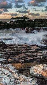 Preview wallpaper lighthouse, rocks, stones, coast, sea