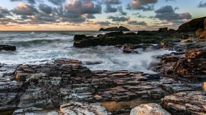 Preview wallpaper lighthouse, rocks, stones, coast, sea