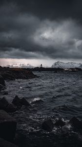 Preview wallpaper lighthouse, rocks, water, mountains
