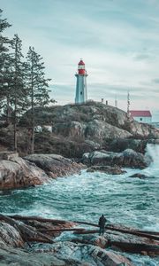 Preview wallpaper lighthouse, rocks, waves, photographer