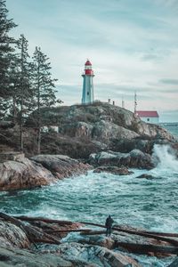 Preview wallpaper lighthouse, rocks, waves, photographer