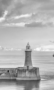 Preview wallpaper lighthouse, sea, bw, horizon, sky, clouds