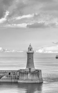 Preview wallpaper lighthouse, sea, bw, horizon, sky, clouds