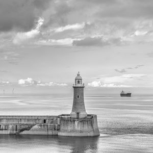 Preview wallpaper lighthouse, sea, bw, horizon, sky, clouds