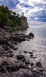 Preview wallpaper lighthouse, sea, cliff, rock, shore